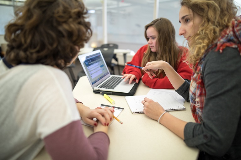 Students working with an instructor